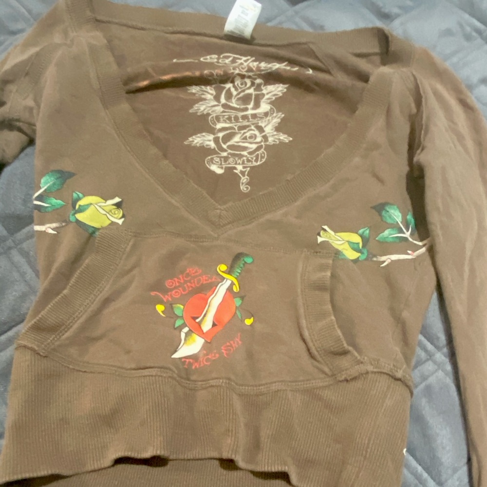 ed   hardy long sleeve used can fit a size medium.